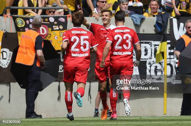 Florian Neuhaus of Duesseldorf jubilates with team mates after scoring the first goal during the Second Bundesliga match between SG Dynamo Dresden...