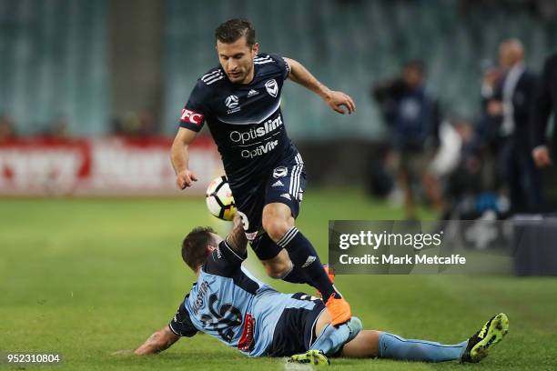 Kosta Barbarouses of the Victory takes on Luke Wilkshire of Sydney FC during the A-League Semi Final match between Sydney FC and Melbourne Victory at...