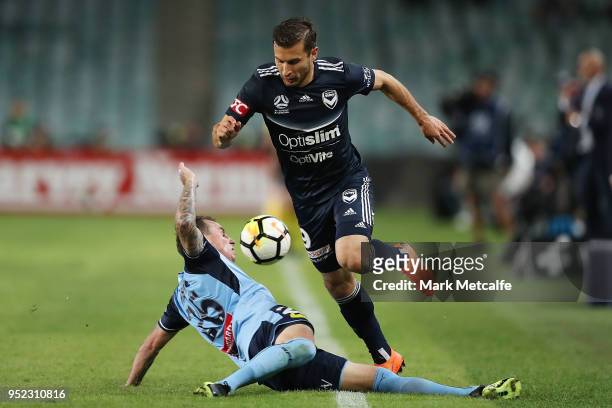 Kosta Barbarouses of the Victory takes on Luke Wilkshire of Sydney FC during the A-League Semi Final match between Sydney FC and Melbourne Victory at...