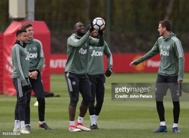 Jesse Lingard, Victor Lindelof, Romelu Lukaku and Nemanja Matic of Manchester United in action during a first team training session at Aon Training...