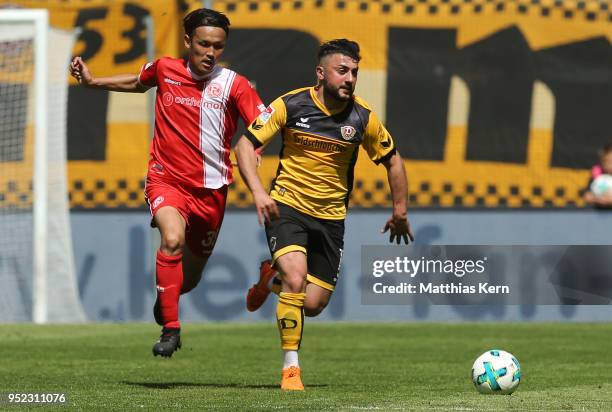 Aias Aosman of Dresden battles for the ball with Takashi Usami of Duesseldorf during the Second Bundesliga match between SG Dynamo Dresden and...