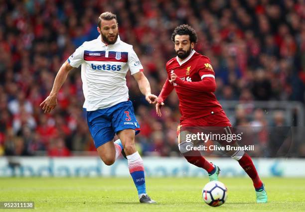 Erik Pieters of Stoke City and Mohamed Salah of Liverpool in action during the Premier League match between Liverpool and Stoke City at Anfield on...