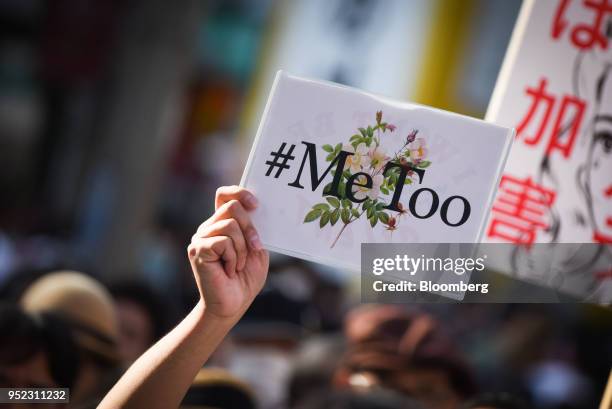 Demonstrator holds a sign reading "#Me Too" during a rally against sexual harassment in Shinjuku, Tokyo, on Saturday, April 28, 2018. Japan's finance...