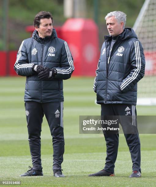 Assistant Manager Rui Faria and Manager Jose Mourinho of Manchester United in action during a first team training session at Aon Training Complex on...