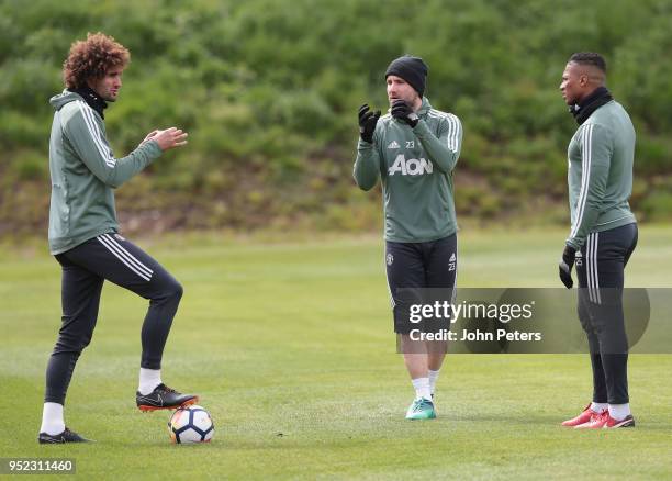 Marouane Fellaini. Luke Shaw and Antonio Valencia of Manchester United in action during a first team training session at Aon Training Complex on...