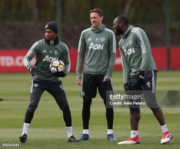 Marcus Rashford, Nemanja Matic and Romelu Lukaku of Manchester United in action during a first team training session at Aon Training Complex on April...
