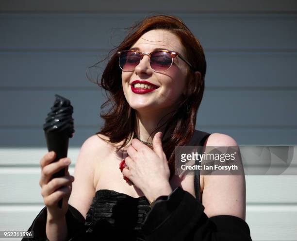 Megan Watts from Scarborough eats a special Goth Weekend ice-cream designed by Trillo's of Whitby during Whitby Gothic Weekend on April 28, 2018 in...