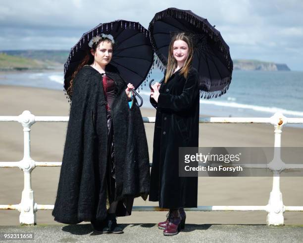 Hannah Dutton and Isla Catherine Grossett from Guisborough pose on the pier as they visit Whitby Gothic Weekend on April 28, 2018 in Whitby, England....