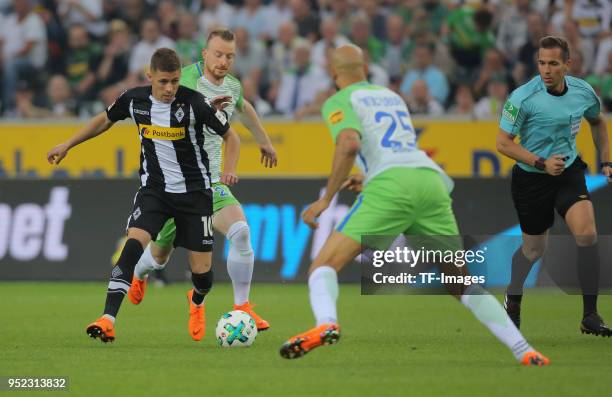 Thorgan Hazard of Moenchengladbach and John Anthony Brooks of Wolfsburg battle for the ball during the Bundesliga match between Borussia...