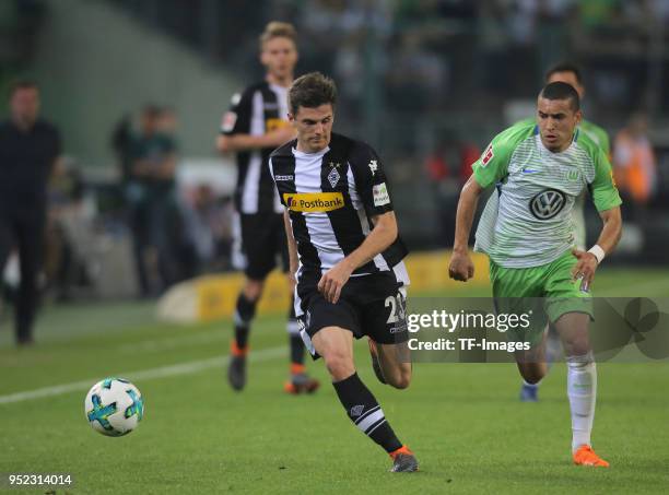 Jonas Hofmann of Moenchengladbach and William of Wolfsburg battle for the ball during the Bundesliga match between Borussia Moenchengladbach and VfL...