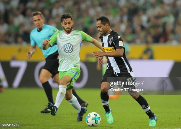 Yunus Malli of Wolfsburg and Raffael of Moenchengladbach battle for the ball during the Bundesliga match between Borussia Moenchengladbach and VfL...