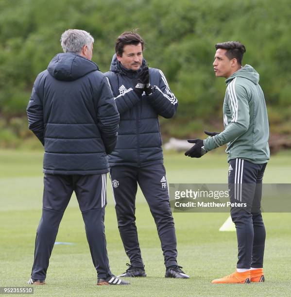 Alexis Sanchez, Assistant Manager Rui Faria and Manager Jose Mourinho of Manchester United in action during a first team training session at Aon...