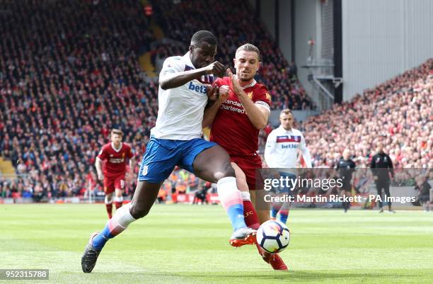 Stoke City's Kurt Zouma and Liverpool's Jordan Henderson during the Premier League match at Anfield, Liverpool.