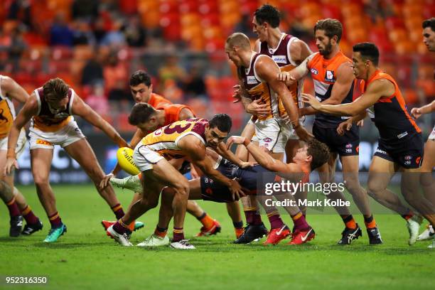 Jason Hopper of the Giants falls as he kicks during the round six AFL match between the Greater Western Sydney Giants and the Brisbane Lions at...