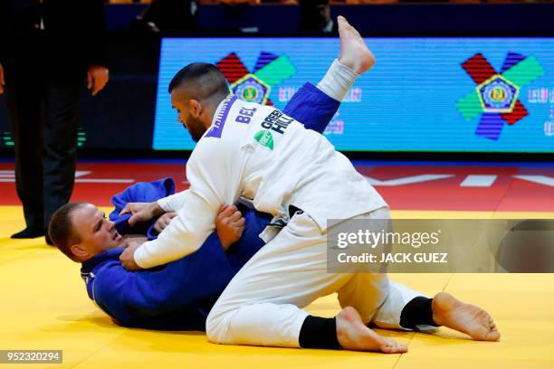 Belgium's Toma Nikiforov competes against Lituania's Karolis Bauza during their men's under 100kg weight category match at the European Judo...