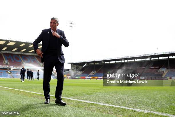 Chris Hughton, Manager of Brighton and Hove Albion walks on the pitch prior to the Premier League match between Burnley and Brighton and Hove Albion...