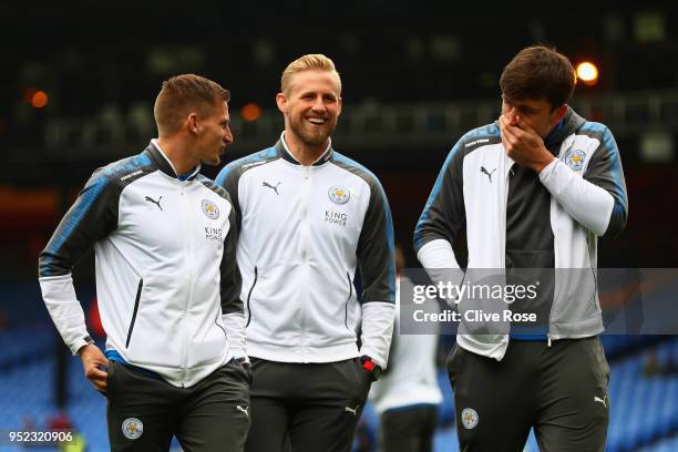 Marc Albrighton, Kasper Schmeichel and Harry Maguire of Leicester City inspect the pitch during the Premier League match between Crystal Palace and...