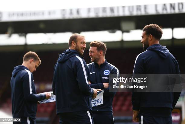 Glenn Murray, Dale Stephens and Connor Goldson of Brighton and Hove Albion wlak on the pitch prior to the Premier League match between Burnley and...