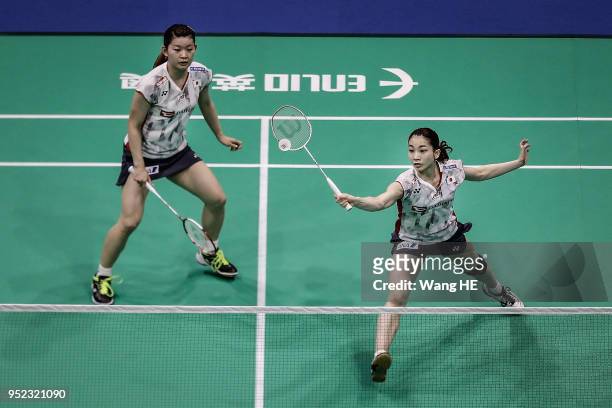 Japan's Ayaka Takahashi and Misaki Matsutomo hits a return during their women's doubles Semi final match against Kim So Yeong and Hee Yong Kong of...
