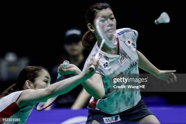 Japan's Ayaka Takahashi and Misaki Matsutomo hits a return during their women's doubles Semi final match against Kim So Yeong and Hee Yong Kong of...