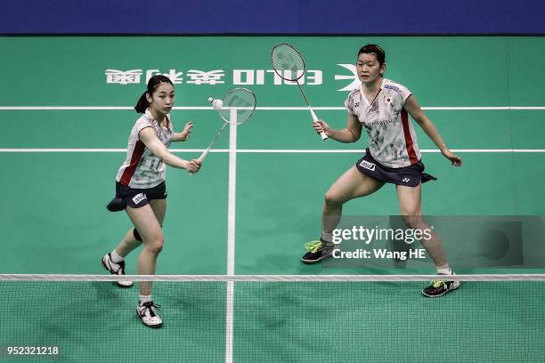 Japan's Ayaka Takahashi and Misaki Matsutomo hits a return during their women's doubles Semi final match against Kim So Yeong and Hee Yong Kong of...