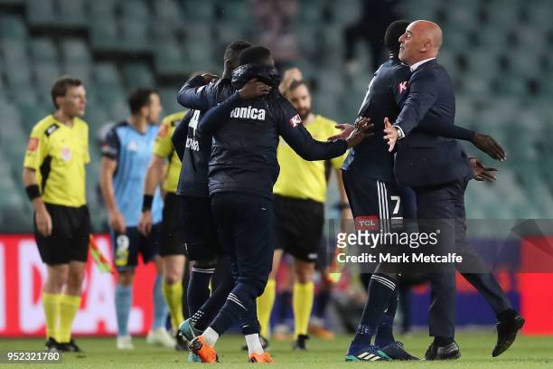Melbourne Victory head coach Kevin Muscat celebrates victory with players during the A-League Semi Final match between Sydney FC and Melbourne...