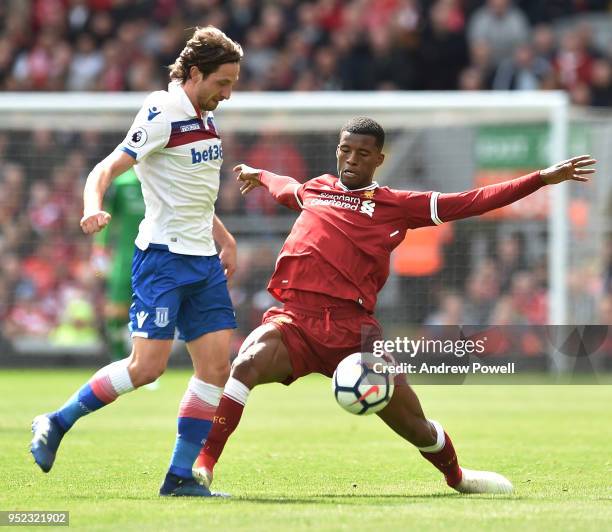 Georginio Wijnaldum of Liverpool with joe Allen of Stoke City during the Premier League match between Liverpool and Stoke City at Anfield on April...