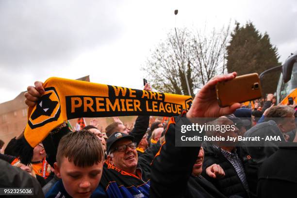 Fans of Wolverhampton Wanderers hold up scarves which read We Are Premier League prior to the Sky Bet Championship match between Wolverhampton...