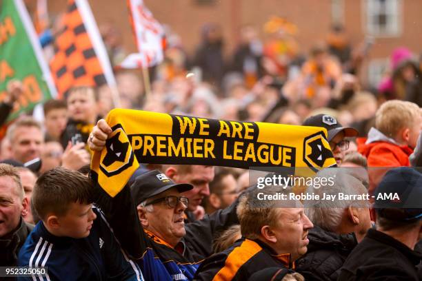 Fans of Wolverhampton Wanderers hold up scarves which read We Are Premier League prior to the Sky Bet Championship match between Wolverhampton...