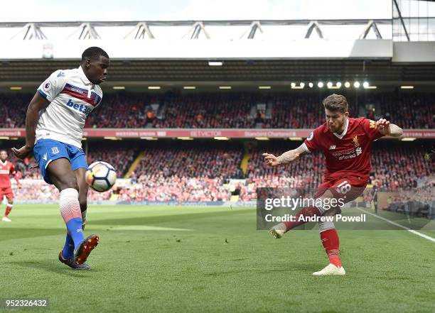 Alberto Moreno of Liverpool with Kurt Zouma of Stoke City during the Premier League match between Liverpool and Stoke City at Anfield on April 28,...