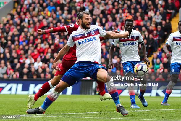 Erik Pieters of Stoke City appears to handle the ball during the Premier League match between Liverpool and Stoke City at Anfield on April 28, 2018...