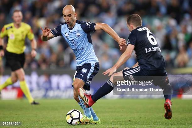 Adrian Mierzejewski of Sydney competes with Leigh Broxham of the Victory during the A-League Semi Final match between Sydney FC and Melbourne Victory...