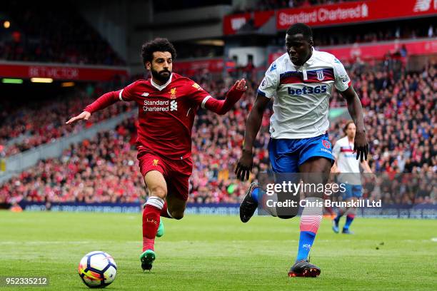 Mohamed Salah of Liverpool in action with Kurt Zouma of Stoke City during the Premier League match between Liverpool and Stoke City at Anfield on...