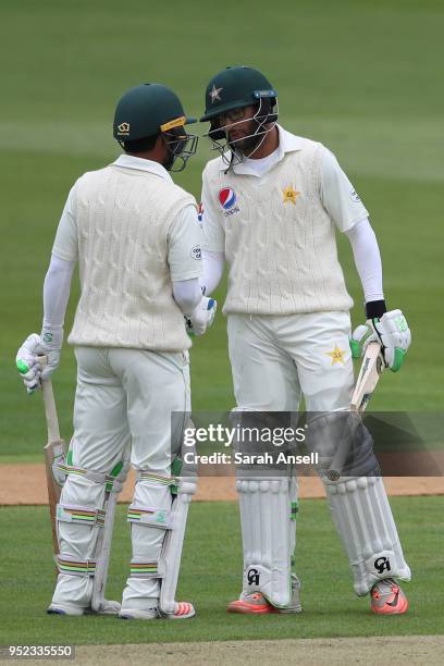 Imam ul-Haq of Pakistan is congratulated by teammate Asad Shafiq after reaching a half century on day 1 of the tour match between Kent and Pakistan...