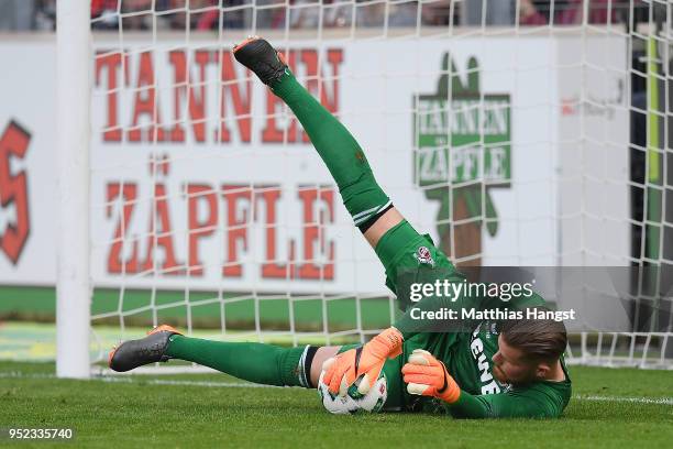 Timo Horn of Koeln saves a penalty by Christian Guenter of Freiburg during the Bundesliga match between Sport-Club Freiburg and 1. FC Koeln at...