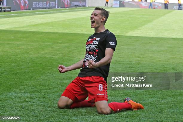 Florian Neuhaus of Duesseldorf jubilates after moving up into the Bundesliga after the Second Bundesliga match between SG Dynamo Dresden and Fortuna...