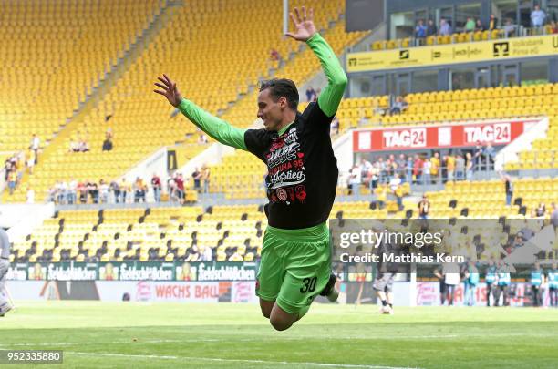 Raphael Wolf of Duesseldorf jubilates after moving up into the Bundesliga after the Second Bundesliga match between SG Dynamo Dresden and Fortuna...
