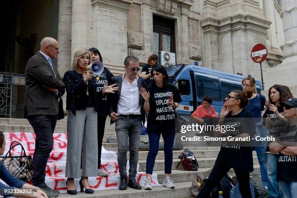 Members of Fratelli d'Italia Party ,Monica Ciaburro and Fabio Rampelli, in solidarity with Primary school teachers that stand with chains and launch...
