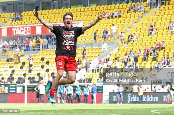 Benito Raman of Duesseldorf jubilates after moving up into the Bundesliga after the Second Bundesliga match between SG Dynamo Dresden and Fortuna...