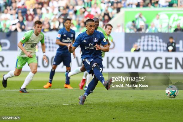 Bobby Wood of Hamburg scores a goal from the penalty spot to make it 0:1 during the Bundesliga match between VfL Wolfsburg and Hamburger SV at...
