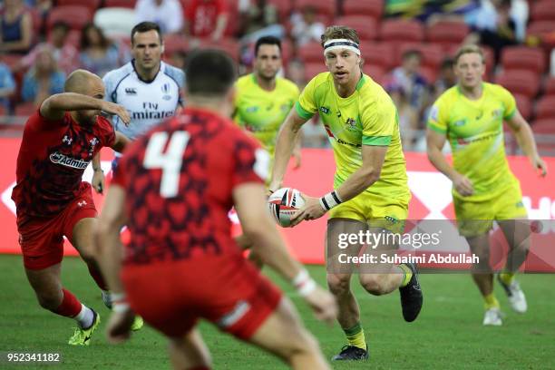 Ben O'Donnell of Australia looks to pass during the 2018 Singapore Sevens Pool D match between Wales and Australia at National Stadium on April 28,...