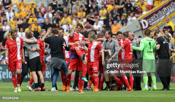 The players of Duesseldorf jubilate after moving up into the Bundesliga after the Second Bundesliga match between SG Dynamo Dresden and Fortuna...