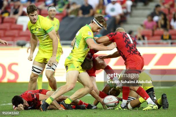 Luke Treharne of Wales and Ben O'Donnell of Australia challenge for the ball during the 2018 Singapore Sevens Pool D match between Wales and...