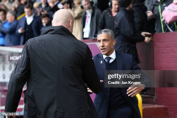 Chris Hughton, Manager of Brighton and Hove Albion and Sean Dyche, Manager of Burnley shake hands prior to the Premier League match between Burnley...