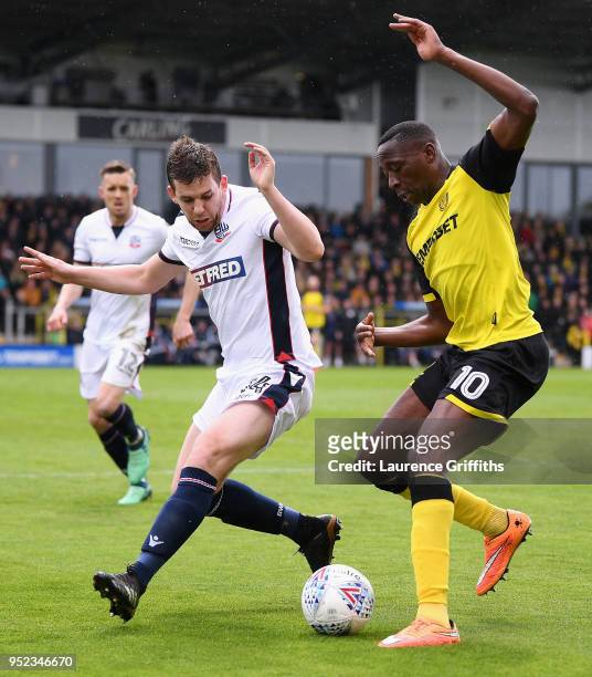 Lucas Akins of Burton Albion is challenged by Jon Flanagan of Bolton Wanderers during the Sky Bet Championship match between Burton Albion and Bolton...