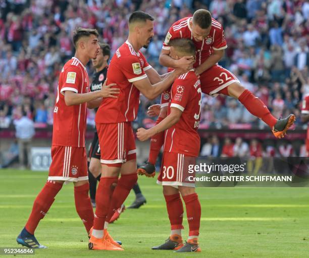 Bayern Munich's German midfielder Niklas Dorsch is congratulated by his teammates Bayern Munich's Serbian midfielder Meritan Shabani , Bayern...