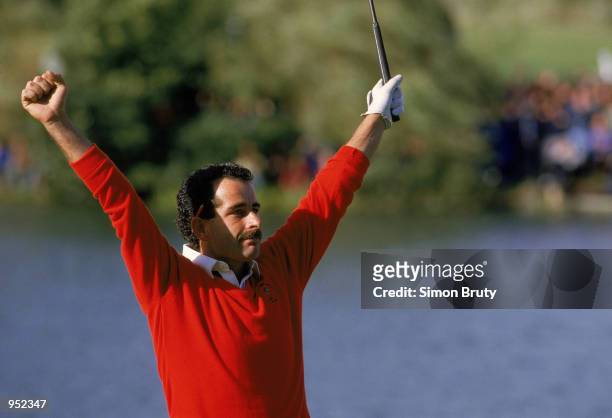 Sam Torrance of the European Team celebrates after holing the putt on 18 to secure victory in the Ryder Cup at the Belfry in Sutton Coldfield,...