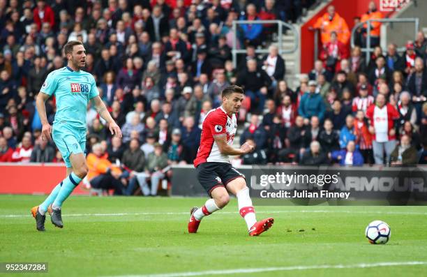 Dusan Tadic of Southampton shoots and scores his side's first goal during the Premier League match between Southampton and AFC Bournemouth at St...