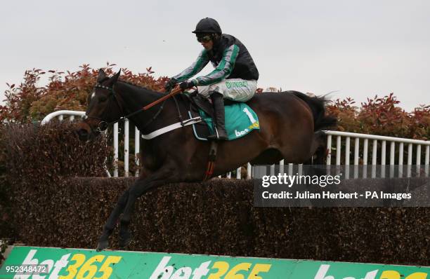 Altior ridden by Nico de Boinville clear an early fence before going on to win The bet 365 Celebration Chase Race run during bet365 Jump Finale day...