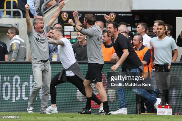 Head coach Friedhelm Funkel of Duesseldorf jubilates after moving up into the Bundesliga after the Second Bundesliga match between SG Dynamo Dresden...